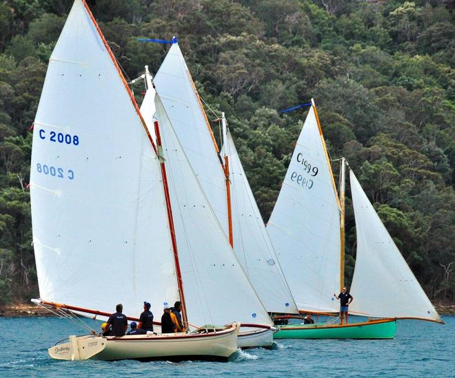 Southerley (foreground) and Rhapsody (green hull) in Sunday's passage race on Pittwater web – Australian Couta Boat Championship ©  Bob Fowler